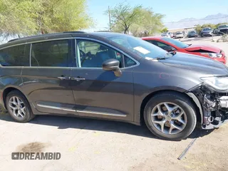 2017 Chrysler Pacifica Touring L with VIN 2C4RC1BG0HR826881, listed as a IAAI auction lot 42171240 with 214,188 mi miles and . Bid and sale history available at DreamBid. Image 13.