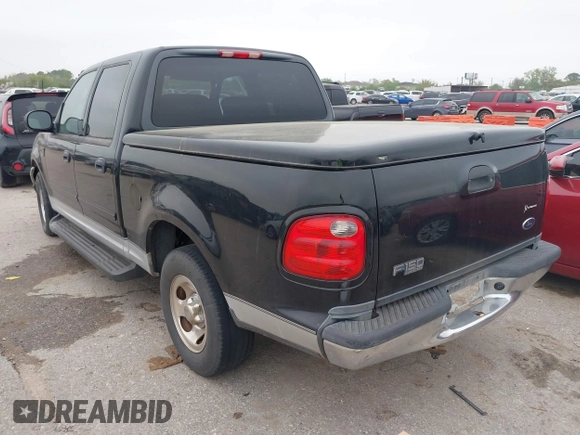 2003 Ford F-150 XLT with VIN 1FTRW07613KD14135, listed as a IAAI auction lot 41879756 with 197,515 mi miles. Bid and sale history available at carsss.com. Image 3.
