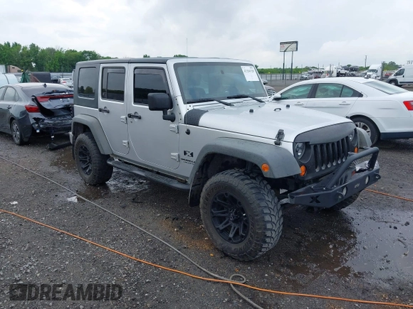 2007 Jeep Wrangler Unlimited X with VIN 1J4GA39187L209448, listed as a IAAI auction lot 42104328 with 138,302 mi miles and . Bid and sale history available at DreamBid. Image 1.