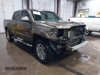 2014 Toyota Tacoma PreRunner z VIN 3TMJU4GNXEM164507, wystawiony jako IAAI lot #42118984 z przebiegiem 183 101 mil mil oraz . Historia ofert i sprzedaży dostępna na DreamBid. Obrazek 1.