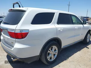 2013 Dodge Durango SXT with VIN 1C4RDHAG0DC696904, listed as a IAAI auction lot 42310831 with 112,964 mi miles and . Bid and sale history available at DreamBid. Image 4.