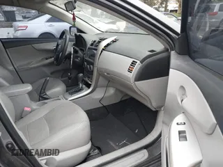 2011 Toyota Corolla L with VIN JTDBU4EE7BJ106810, listed as a IAAI auction lot 42054750 with 256,064 mi miles. Bid and sale history available at carsss.com. Image 5.