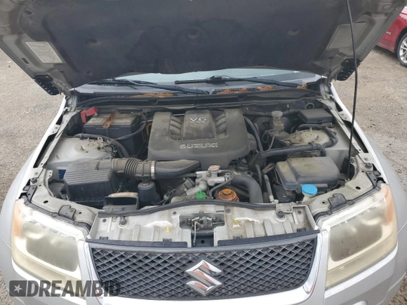2006 Suzuki Grand Vitara z VIN JS3TE941764101657, wystawiony jako Copart lot #54943205 z przebiegiem 206 744 mil mil oraz Szkody całkowita. Historia ofert i sprzedaży dostępna na DreamBid. Obrazek 12.