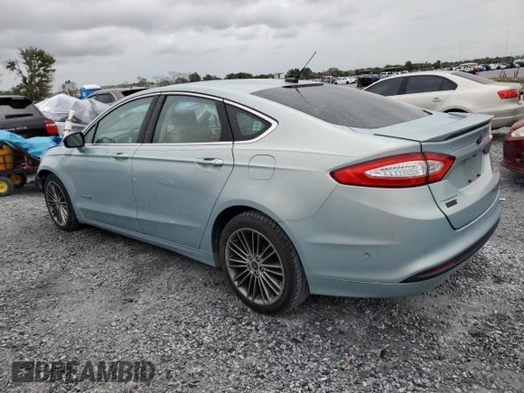 2013 Ford Fusion SE Hybrid z VIN 3FA6P0LU6DR174719, wystawiony jako Copart lot #62877715 z przebiegiem 52 884 mil mil oraz Szkoda całkowita • Salvage title. Historia ofert i sprzedaży dostępna na DreamBid. Obrazek 2.
