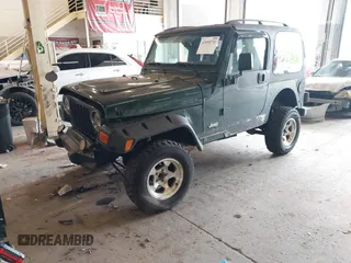 2000 Jeep Wrangler Sport with VIN 1J4FA49S8YP780104, listed as a IAAI auction lot 42095731 with Not provided miles and . Bid and sale history available at DreamBid. Image 2.