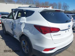 2017 Hyundai Santa Fe 2.4L z VIN 5NMZUDLB9HH028990, wystawiony jako IAAI lot #42055991 z przebiegiem 91 569 mil mil oraz . Historia ofert i sprzedaży dostępna na DreamBid. Obrazek 3.