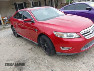 2011 Ford Taurus SHO z VIN 1FAHP2KT6BG115770, wystawiony jako IAAI lot #42229921 z przebiegiem 121 748 mil mil oraz . Historia ofert i sprzedaży dostępna na DreamBid. Obrazek 1.