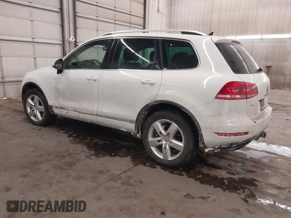 2013 Volkswagen Touareg Lux with VIN WVGEF9BP5DD011511, listed as a IAAI auction lot 41608840 with 167,350 mi miles and . Bid and sale history available at DreamBid. Image 3.