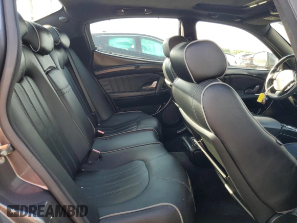 2011 Maserati Quattroporte S z VIN ZAM39JKAXB0059649, wystawiony jako Copart lot #76566944 z przebiegiem 35 261 mil mil oraz Czysty tytuł • Clean title. Historia ofert i sprzedaży dostępna na DreamBid. Obrazek 10.