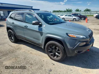 2015 Jeep Cherokee Trailhawk with VIN 1C4PJMBS4FW687328, listed as a Copart auction lot 58927765 with 119,483 mi miles and Non repairable. Bid and sale history available at DreamBid. Image 4.