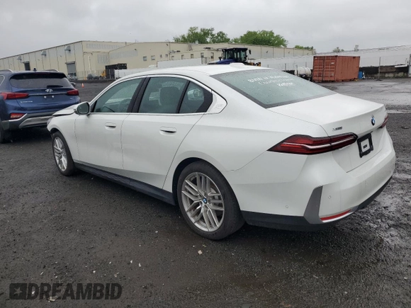 2024 BMW 5 Series 530i xDrive with VIN WBA53FJ01RCP97253, listed as a Copart auction lot 50888795 with 11,985 mi miles and Salvage title. Bid and sale history available at DreamBid. Image 2.