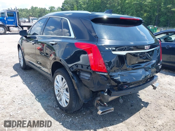 2018 Cadillac XT5 Premium Luxury AWD z VIN 1GYKNFRS3JZ112459, wystawiony jako IAAI lot #42590258 z przebiegiem 157 377 mil mil oraz . Historia ofert i sprzedaży dostępna na DreamBid. Obrazek 3.