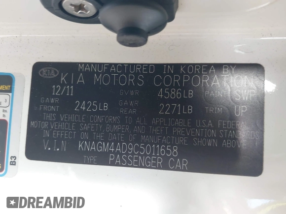 2012 Kia Optima Hybrid with VIN KNAGM4AD9C5011658, listed as a IAAI auction lot 42197129 with 142,977 mi miles. Bid and sale history available at carsss.com. Image 9.