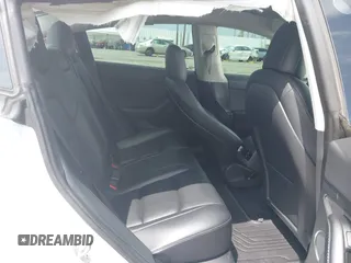 2021 Tesla Model 3 Performance with VIN 5YJ3E1EC2MF084594, listed as a IAAI auction lot 42030339 with 43,215 mi miles and . Bid and sale history available at DreamBid. Image 8.