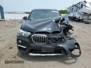 2018 BMW X1 xDrive28i with VIN WBXHT3C36J3H29952, listed as a Copart auction lot 59679285 with 75,220 mi miles and Salvage title. Bid and sale history available at DreamBid. Image 5.