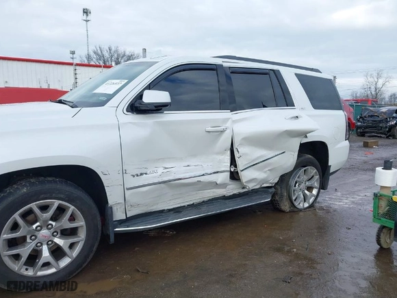 2016 GMC Yukon SLT with VIN 1GKS2BKCXGR195010, listed as a IAAI auction lot 41226537 with 130,919 mi miles. Bid and sale history available at carsss.com. Image 6.