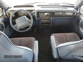 1993 Plymouth Voyager z VIN 2P4GH25K1PR283274, wystawiony jako Copart lot #79144394 z przebiegiem 105 890 mil mil oraz Tytuł czysty. Historia ofert i sprzedaży dostępna na DreamBid. Obrazek 8.