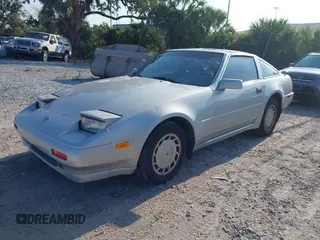 1987 Nissan 300ZX z VIN JN1HZ14S6HX214121, wystawiony jako IAAI lot #42204712 z przebiegiem 218 637 mil mil oraz . Historia ofert i sprzedaży dostępna na DreamBid. Obrazek 2.