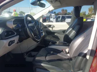 2021 Chrysler Pacifica Hybrid Touring L with VIN 2C4RC1L76MR581285, listed as a IAAI auction lot 42303222 with 77,808 mi miles and . Bid and sale history available at DreamBid. Image 5.
