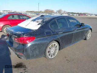 2018 BMW 5 Series M550i xDrive with VIN WBAJB9C59JG463948, listed as a IAAI auction lot 41845989 with 99,385 mi miles. Bid and sale history available at carsss.com. Image 4.