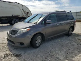 2015 Toyota Sienna XLE with VIN 5TDYK3DC5FS643985, listed as a Copart auction lot 56956505 with 179,131 mi miles and Salvage title. Bid and sale history available at DreamBid. Image 1.