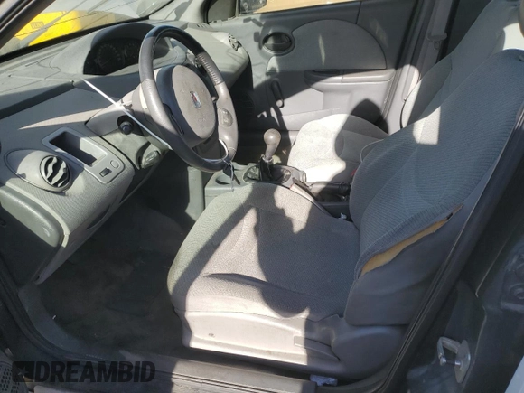 2003 Saturn ION ION 1 z VIN 1G8AF52F83Z143886, wystawiony jako Copart lot #84056904 z przebiegiem 115 839 mil mil oraz Szkoda całkowita • Salvage title. Historia ofert i sprzedaży dostępna na DreamBid. Obrazek 7.