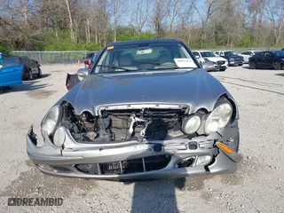 2003 Mercedes-Benz E-Class 3.2L with VIN WDBUF65J93X099223, listed as a IAAI auction lot 42033473 with 230,758 mi miles. Bid and sale history available at carsss.com. Image 12.
