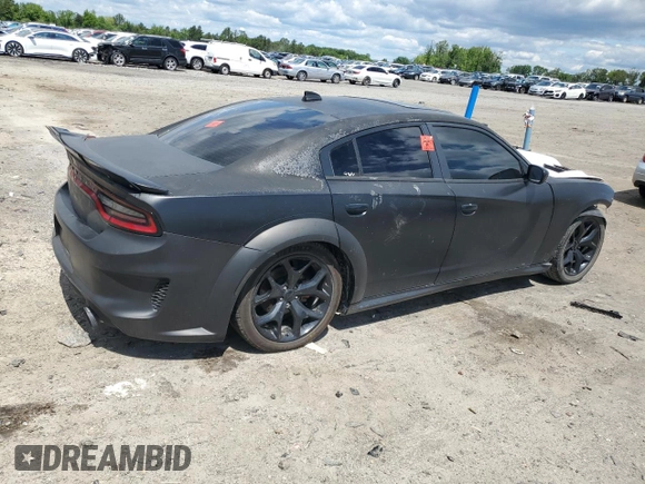 2015 Dodge Charger RT with VIN 2C3CDXCT9FH784672, listed as a Copart auction lot 58190615 with 121,033 mi miles and Salvage title. Bid and sale history available at DreamBid. Image 3.