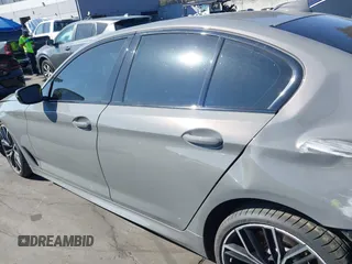 2022 BMW 5 Series M550i xDrive with VIN WBA13BK02NCJ61943, listed as a IAAI auction lot 41607980 with Not provided miles and . Bid and sale history available at DreamBid. Image 15.