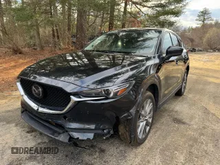 2020 Mazda CX-5 Grand Touring with VIN JM3KFADM8L0785373, listed as a Copart auction lot 50829175 with 135,736 mi miles and Clean Title. Bid and sale history available at DreamBid. Image 2.