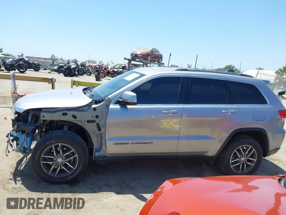 2018 Jeep Grand Cherokee Laredo E with VIN 1C4RJEAG2JC429850, listed as a IAAI auction lot 42541574 with 72,009 mi miles and . Bid and sale history available at DreamBid. Image 15.