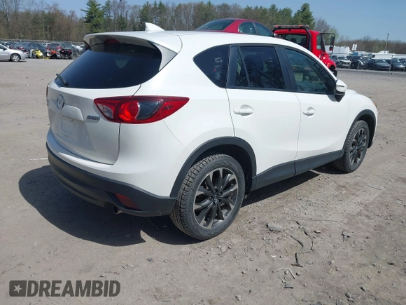 2016 Mazda CX-5 Grand Touring with VIN JM3KE4DY0G0632693, listed as a IAAI auction lot 42123142 with 106,592 mi miles. Bid and sale history available at carsss.com. Image 4.
