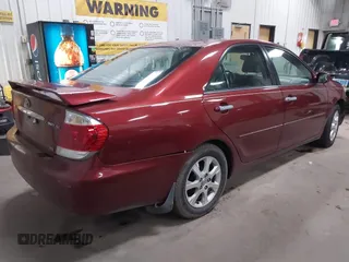 2005 Toyota Camry LE with VIN 4T1BF30KX5U099450, listed as a IAAI auction lot 41670099 with Not Provided miles and . Bid and sale history available at DreamBid. Image 4.