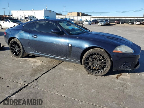 2008 Jaguar XK with VIN SAJWA43C589B23096, listed as a Copart auction lot 79337334 with 143,902 mi miles and Salvage Title. Bid and sale history available at carsss.com. Image 4.