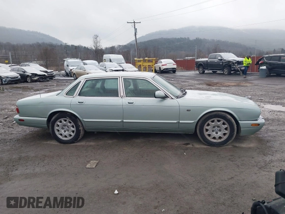 1998 Jaguar XJ with VIN SAJHN1242WC819689, listed as a IAAI auction lot 41148530 with 60,143 mi miles and . Bid and sale history available at DreamBid. Image 13.