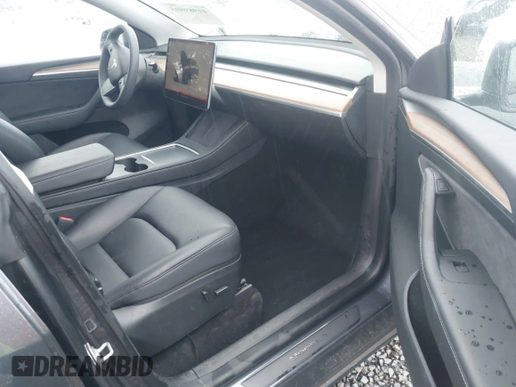 2023 Tesla Model Y Long Range with VIN 7SAYGAEE4PF871281, listed as a IAAI auction lot 41989805 with 15,501 mi miles. Bid and sale history available at carsss.com. Image 5.