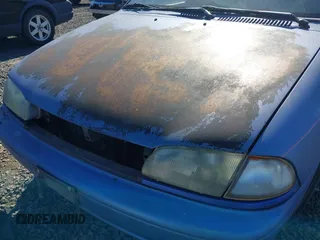 1995 Ford Aspire z VIN KNJLT06H7S6105536, wystawiony jako IAAI lot #41860978 z przebiegiem 66 132 mil mil oraz . Historia ofert i sprzedaży dostępna na DreamBid. Obrazek 6.