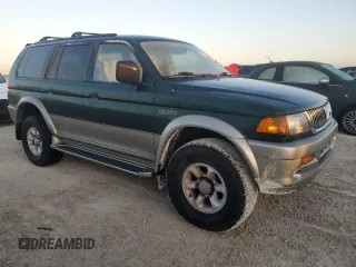 1999 Mitsubishi Montero Limited z VIN JA4LS41RXXP010154, wystawiony jako Copart lot #77666734 z przebiegiem Nie podano mil oraz Szkoda całkowita • Salvage title. Historia ofert i sprzedaży dostępna na DreamBid. Obrazek 4.