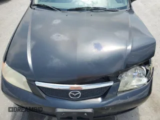 2002 Mazda Protege DX z VIN JM1BJ225020537013, wystawiony jako Copart lot #56952495 z przebiegiem 129 846 mil mil oraz Czysty tytuł • Clean title. Historia ofert i sprzedaży dostępna na DreamBid. Obrazek 11.