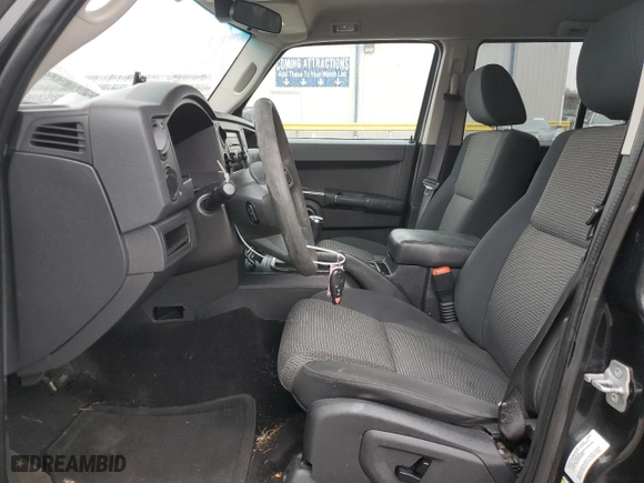 2010 Jeep Commander Sport with VIN 1J4RG4GK0AC128959, listed as a Copart auction lot 43027505 with 144,994 mi miles and Salvage Title. Bid and sale history available at carsss.com. Image 7.