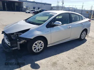 2022 Toyota Prius L Eco z VIN JTDKAMFUXN3176986, wystawiony jako Copart lot #51250675 z przebiegiem 115 272 mil mil oraz Szkoda całkowita • Salvage title. Historia ofert i sprzedaży dostępna na DreamBid. Obrazek 1.