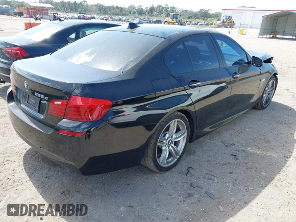 2014 BMW 5 Series 535d with VIN WBAXA5C58ED690447, listed as a IAAI auction lot 41577468 with 149,080 mi miles and . Bid and sale history available at carsss.com. Image 4.