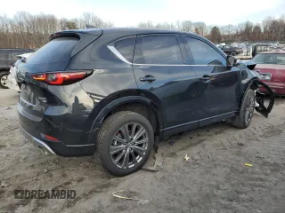 2024 Mazda CX-5 2.5 Turbo Signature with VIN JM3KFBXY7R0515256, listed as a Copart auction lot 87404694 with 4,699 mi miles and Salvage Title. Bid and sale history available at carsss.com. Image 3.