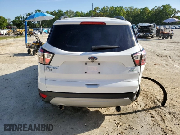 2018 Ford Escape SE with VIN 1FMCU0GD6JUA73082, listed as a Copart auction lot 50879005 with 148,900 mi miles and Salvage Title. Bid and sale history available at carsss.com. Image 6.