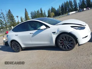 2023 Tesla Model Y Performance with VIN 7SAYGDEF2PF754938, listed as a IAAI auction lot 42067041 with 21,103 mi miles and . Bid and sale history available at DreamBid. Image 13.