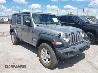 2021 Jeep Wrangler Unlimited Freedom z VIN 1C4HJXDN2MW544730, wystawiony jako IAAI lot #42624402 z przebiegiem 60 993 mil mil oraz . Historia ofert i sprzedaży dostępna na DreamBid. Obrazek 1.