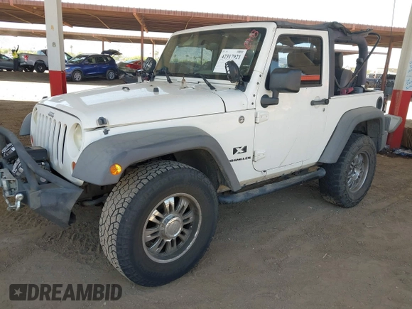 2007 Jeep Wrangler X with VIN 1J4FA24137L128418, listed as a IAAI auction lot 42317921 with 148,412 mi miles and . Bid and sale history available at DreamBid. Image 17.