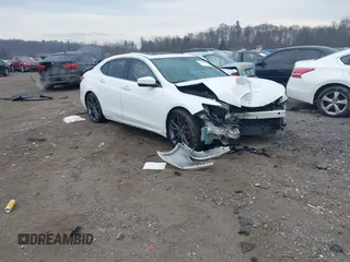 2015 Acura TLX V6 with VIN 19UUB2F3XFA023878, listed as a IAAI auction lot 41673786 with 129,858 mi miles. Bid and sale history available at carsss.com. Image 1.
