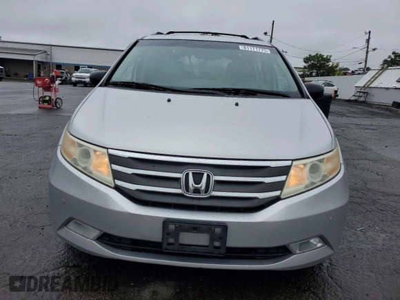 2011 Honda Odyssey Touring with VIN 5FNRL5H99BB021223, listed as a Copart auction lot 61171775 with 194,029 mi miles and Salvage title. Bid and sale history available at DreamBid. Image 5.