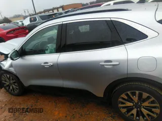 2020 Ford Escape Titanium Hybrid with VIN 1FMCU0DZ8LUB13911, listed as a IAAI auction lot 41249498 with 64,108 mi miles and . Bid and sale history available at DreamBid. Image 14.
